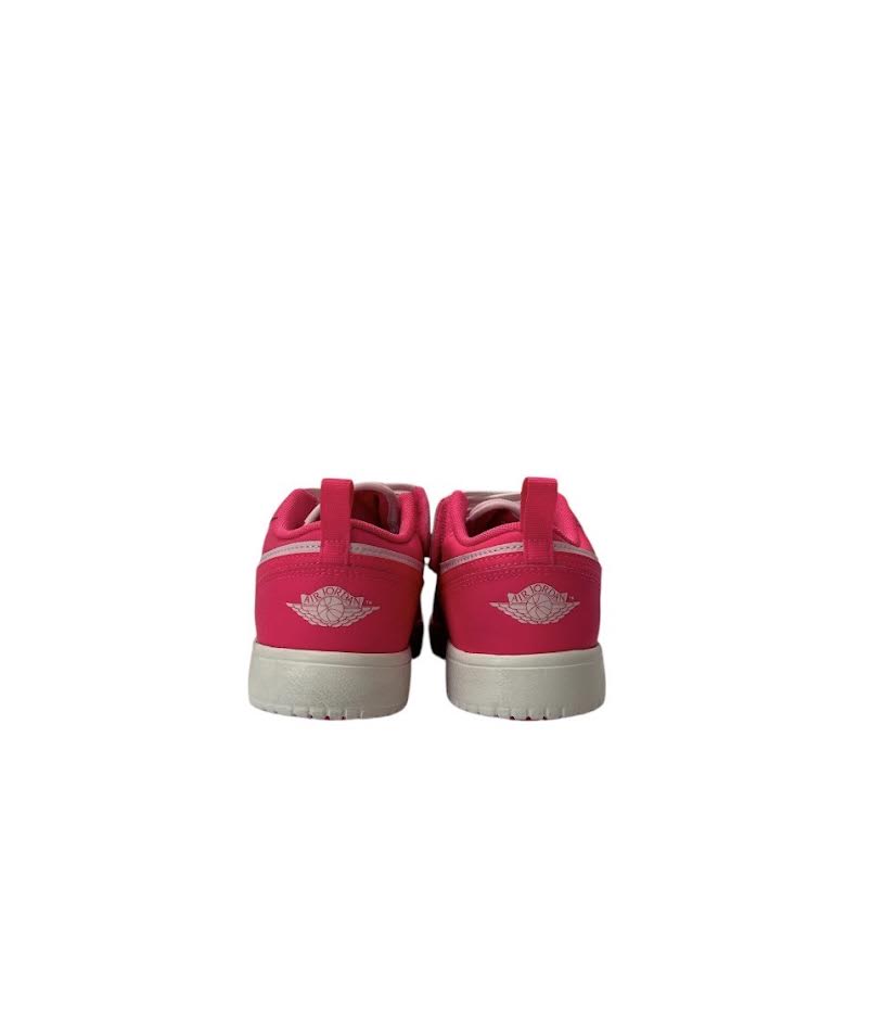 Pink sneakers with white soles on a white background