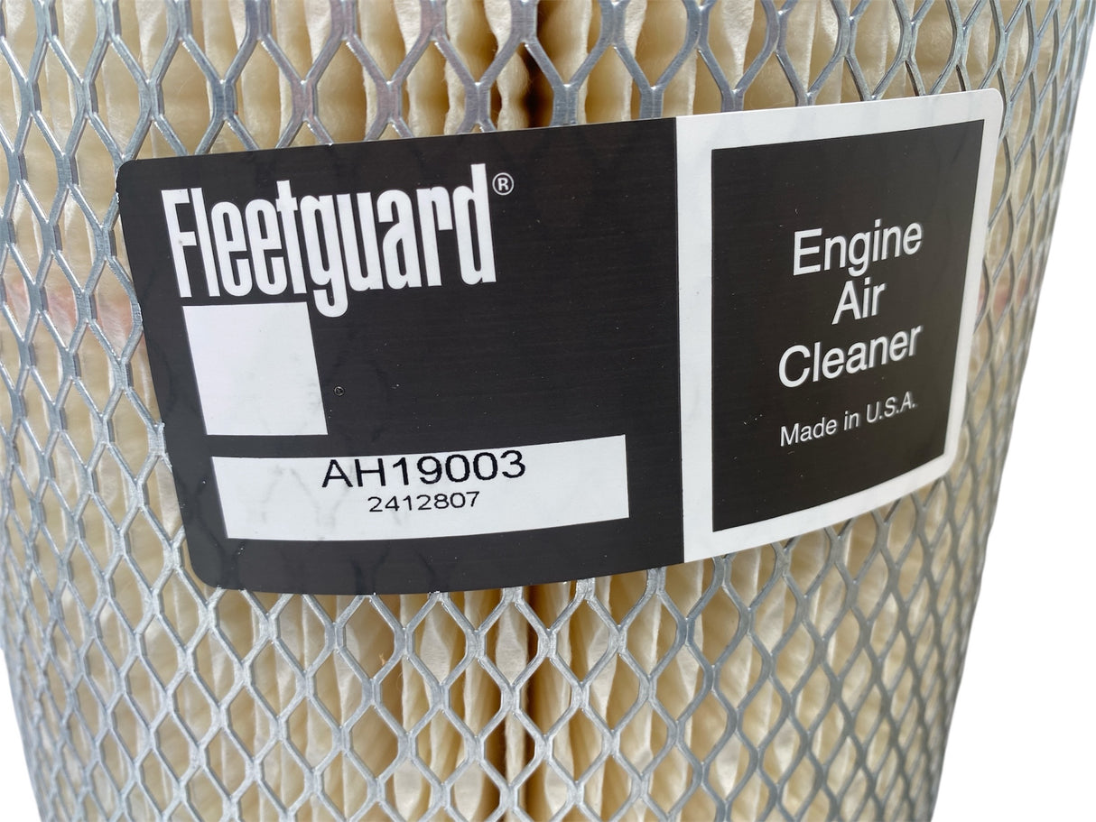 Fleetguard engine air cleaner with label on a white background