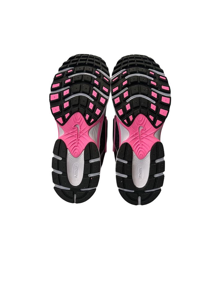 Black and pink athletic shoe sole on a white background