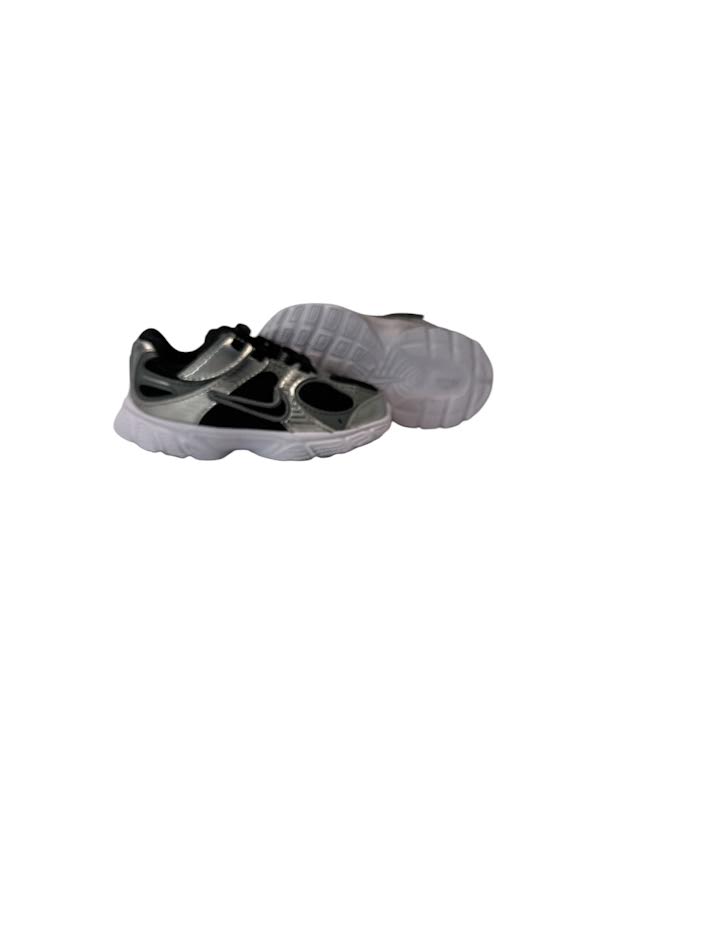 Pair of gray and black shoes on a white background