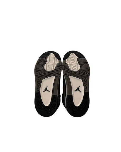 Black and white athletic shoes with a logo on a white background