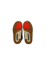 Pair of brown insoles with red arch support on a white background
