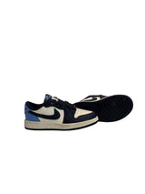 Black and white sneakers with a blue accent on a white background