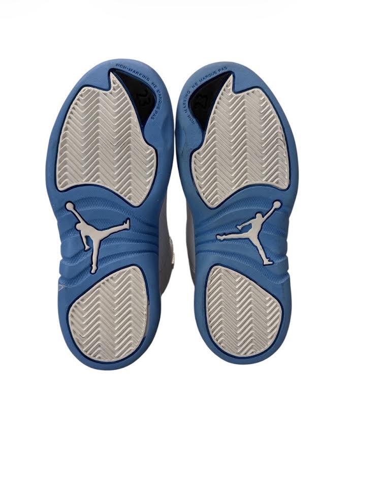 Blue and gray athletic shoes with a logo on a white background
