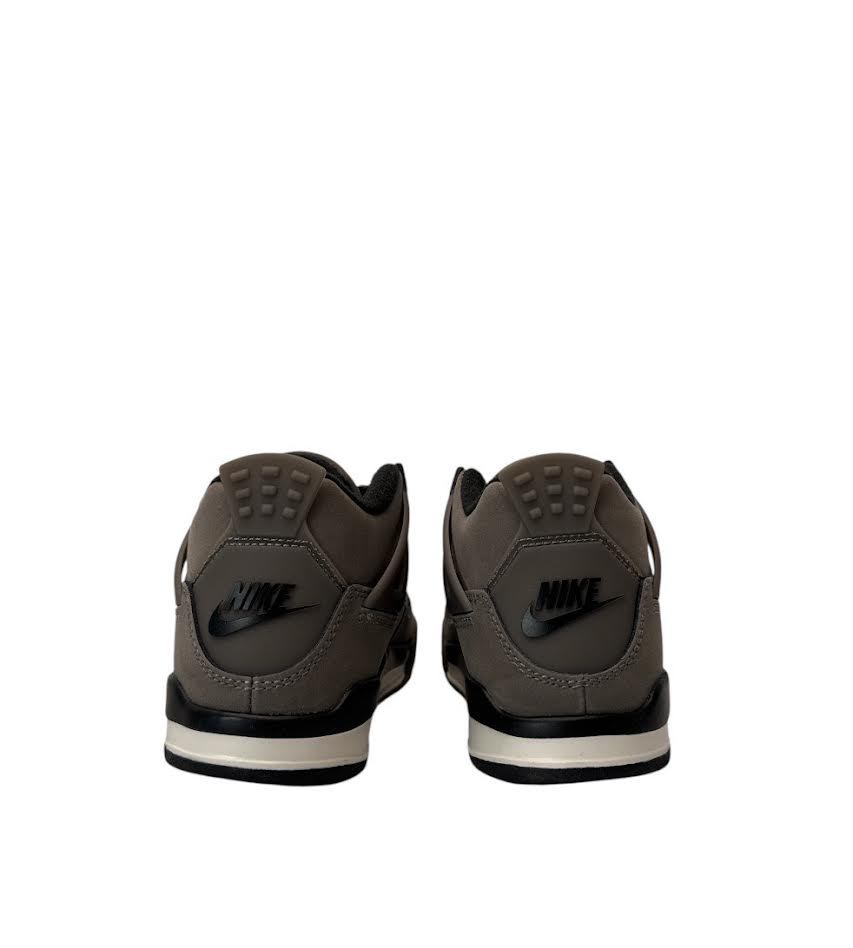 Brown Nike sneakers shown from the back on a white background