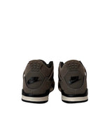 Brown Nike sneakers shown from the back on a white background