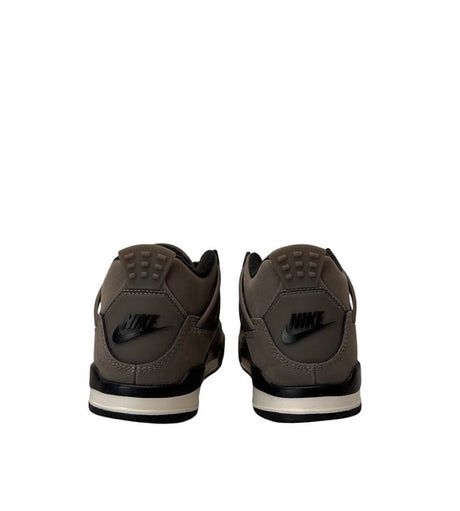 Brown Nike sneakers shown from the back on a white background