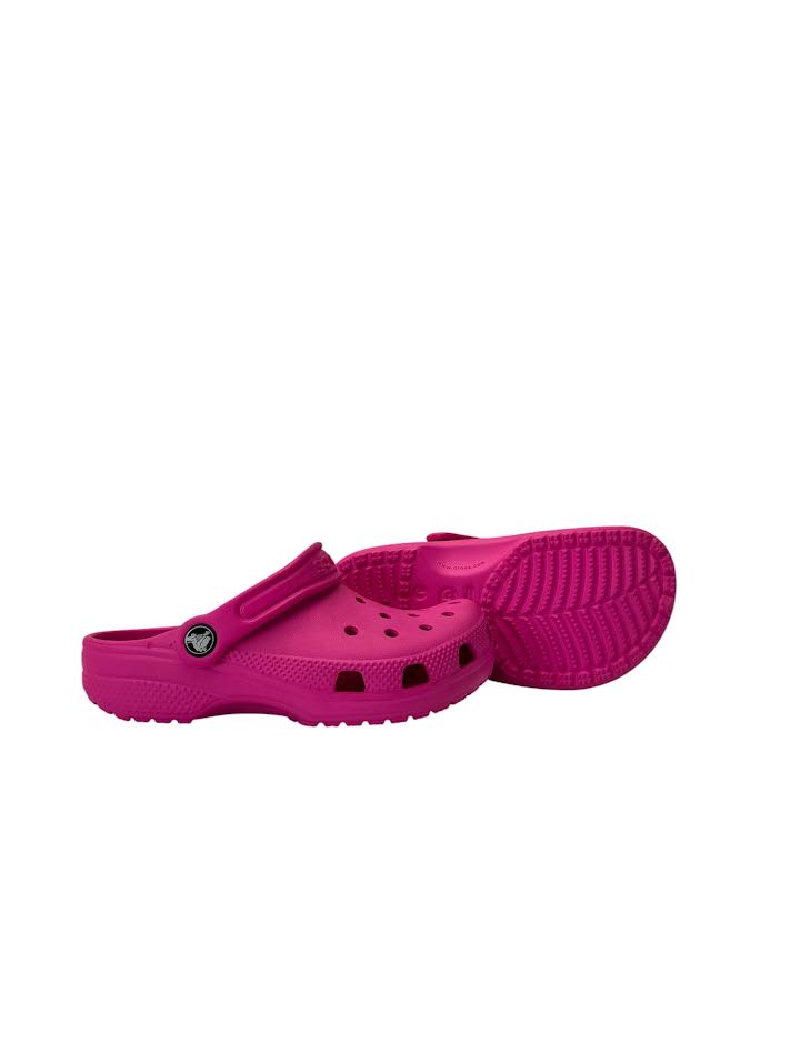 Pink clogs on a white background