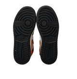 Black sole of a shoe with Nike logo on a white background