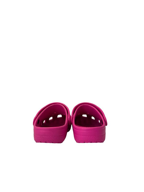 Pair of pink sandals on a white background