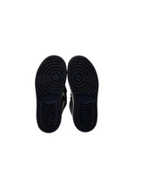 Black sneakers shown from the sole on a white background