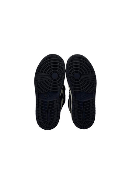 Black sneakers shown from the sole on a white background