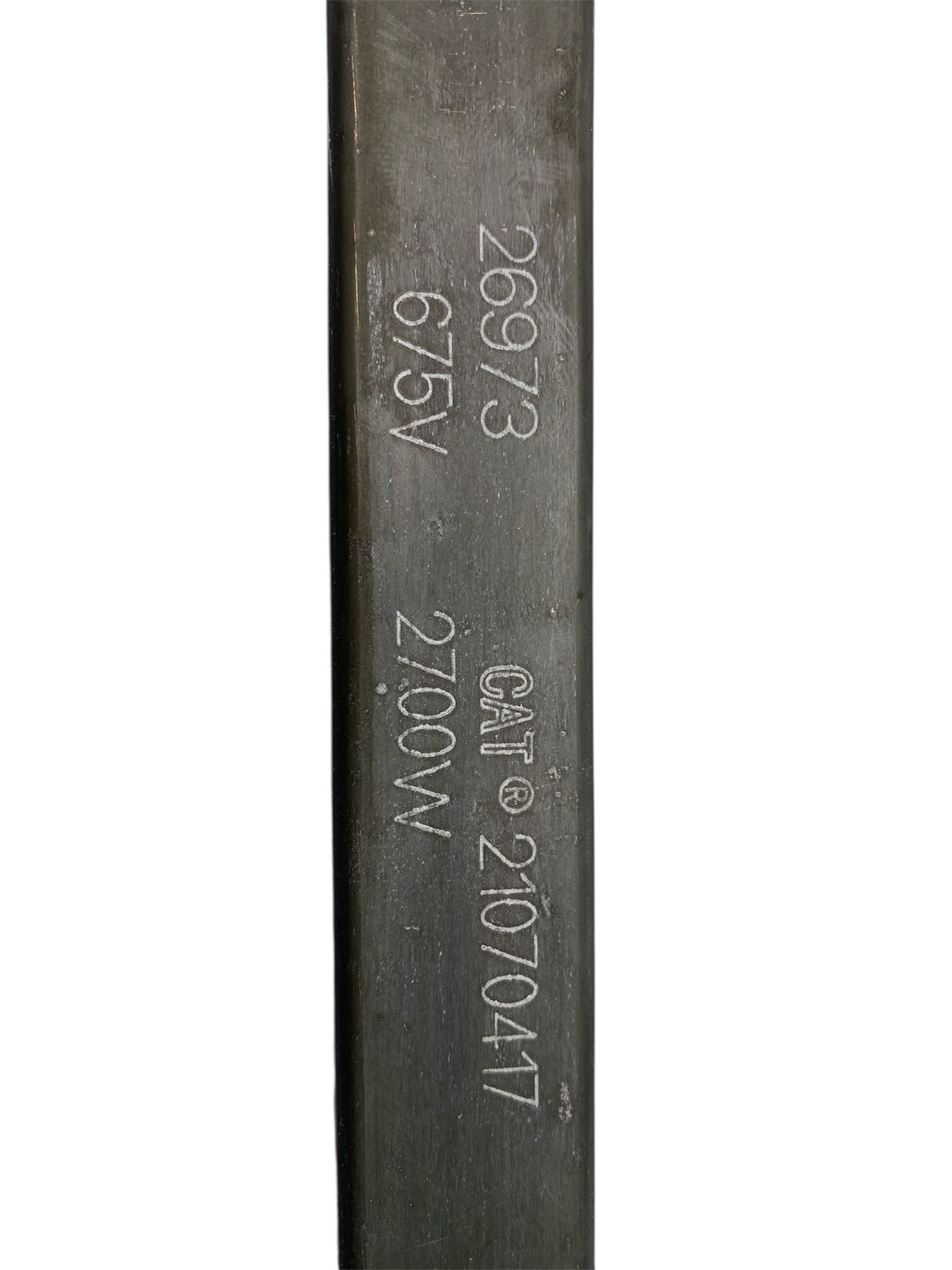 Metal rod with engraved text on a white background