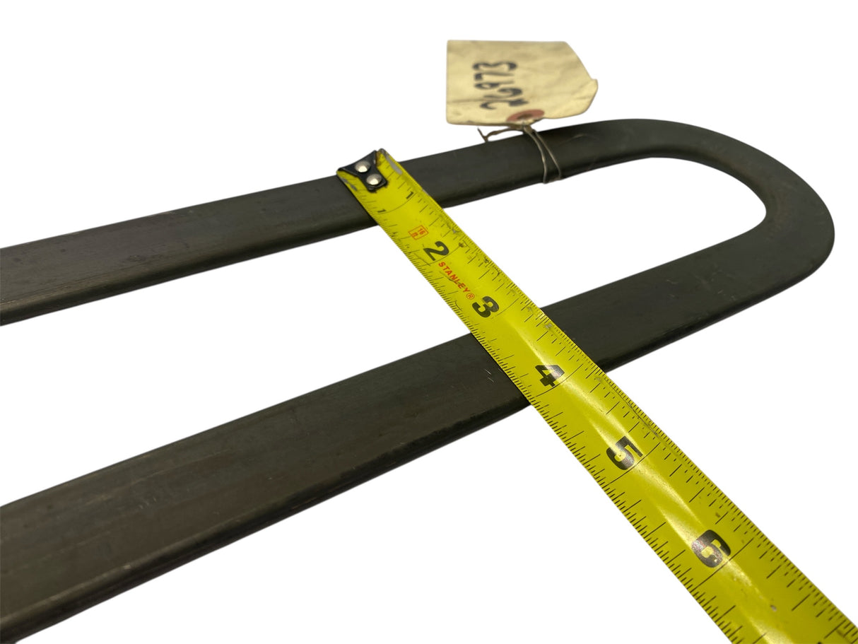 Black belt with a yellow measuring tape and a tag on a white background