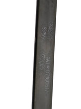 Close-up of a cylindrical metal component with engraved text on a white background