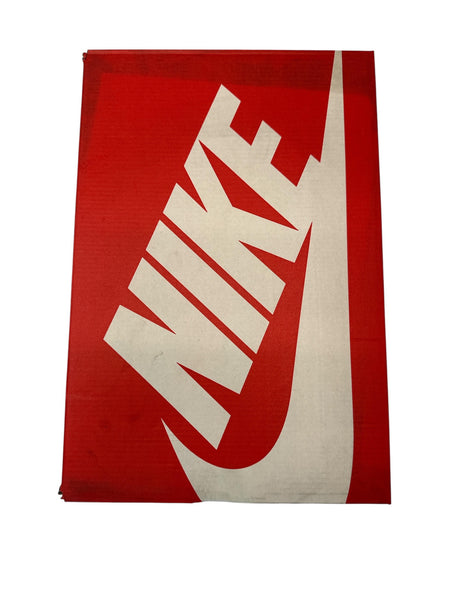 Red towel with white Nike logo on a white background