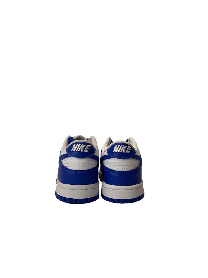 White sneakers with blue accents on a white background