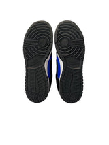 Black and blue athletic shoes with sole view on a white background