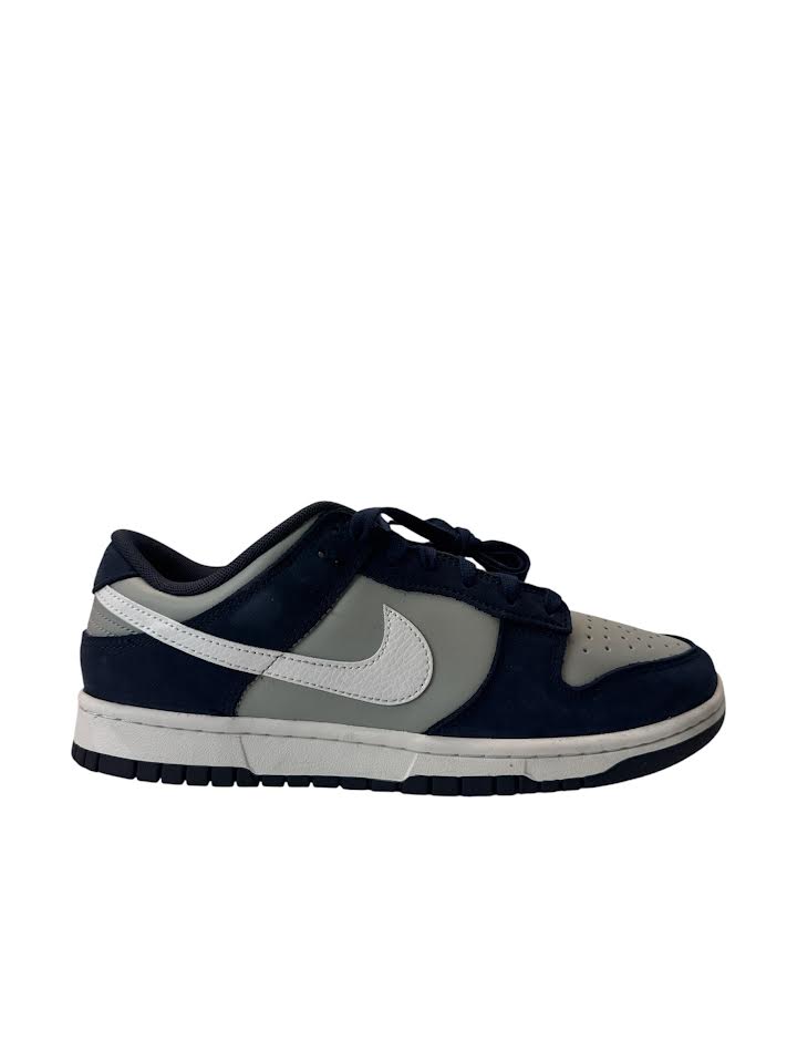 Navy and gray sneaker with Nike logo on a white background
