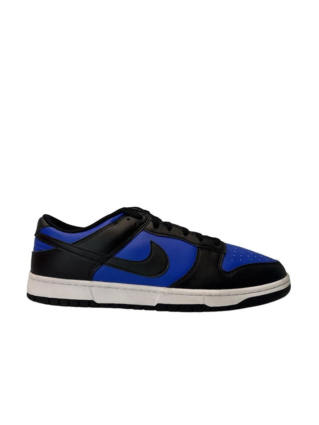 Black and blue sneaker with a Nike logo on a white background