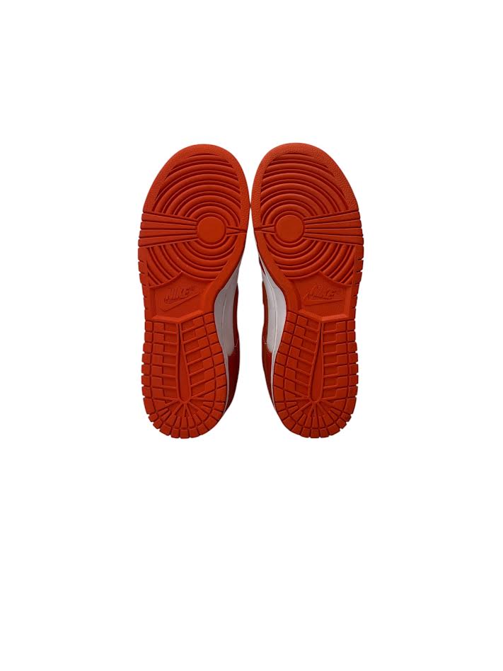 Red sole of a shoe on a white background