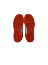 Red sole of a shoe on a white background