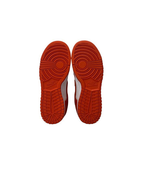 Red sole of a shoe on a white background