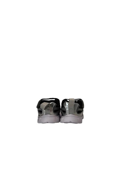 Pair of silver sneakers on a white background