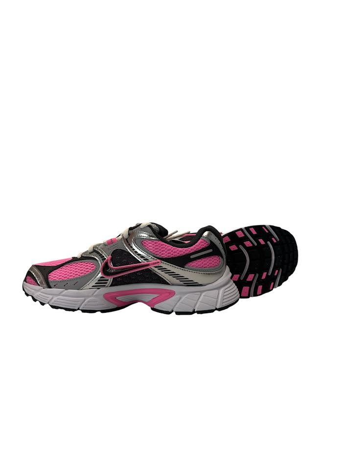 Pair of black and pink running shoes on a white background