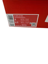 Red box with a white label containing product information and a barcode.