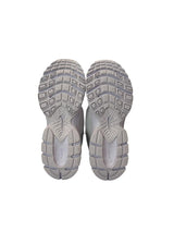 Pair of gray athletic shoes with tread pattern on a white background