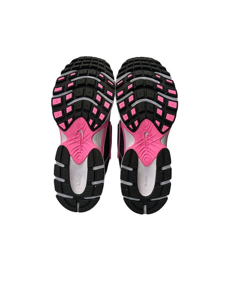 Black and pink athletic shoe sole on a white background