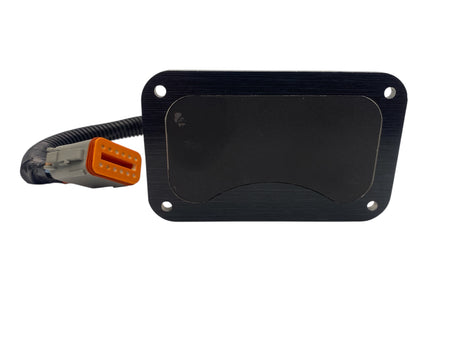 Black rectangular electronic module with a cable on a white background