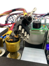 Close-up of electronic components with wires and a circuit board.