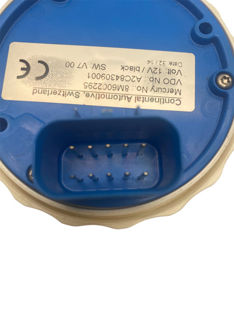 Close-up of a GE electrical component with a label on a white background