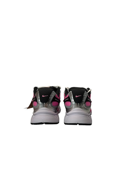 Pair of Nike sneakers with pink accents on a white background