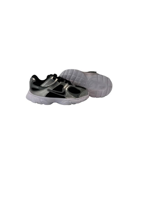 Pair of gray and black shoes on a white background