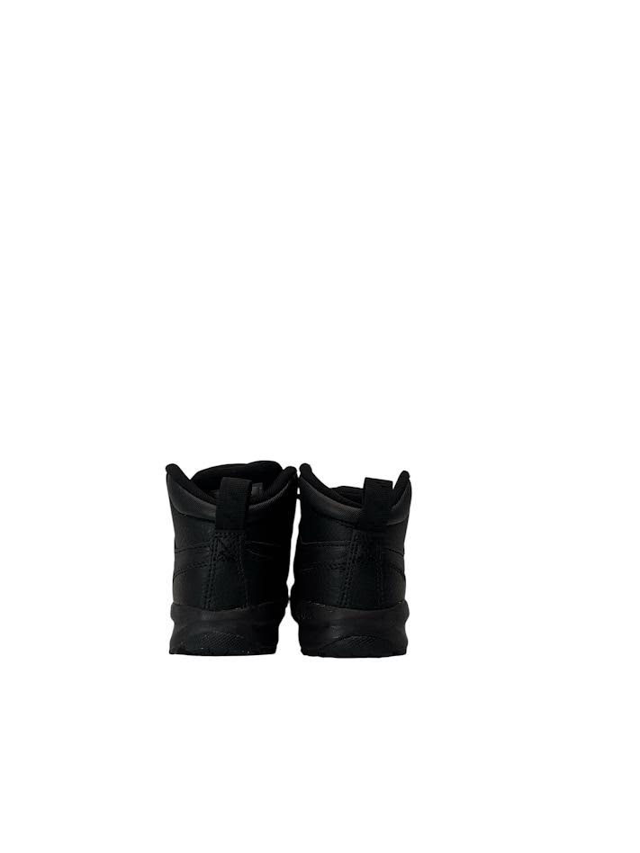 Pair of black boots on a white background