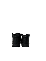 Pair of black boots on a white background