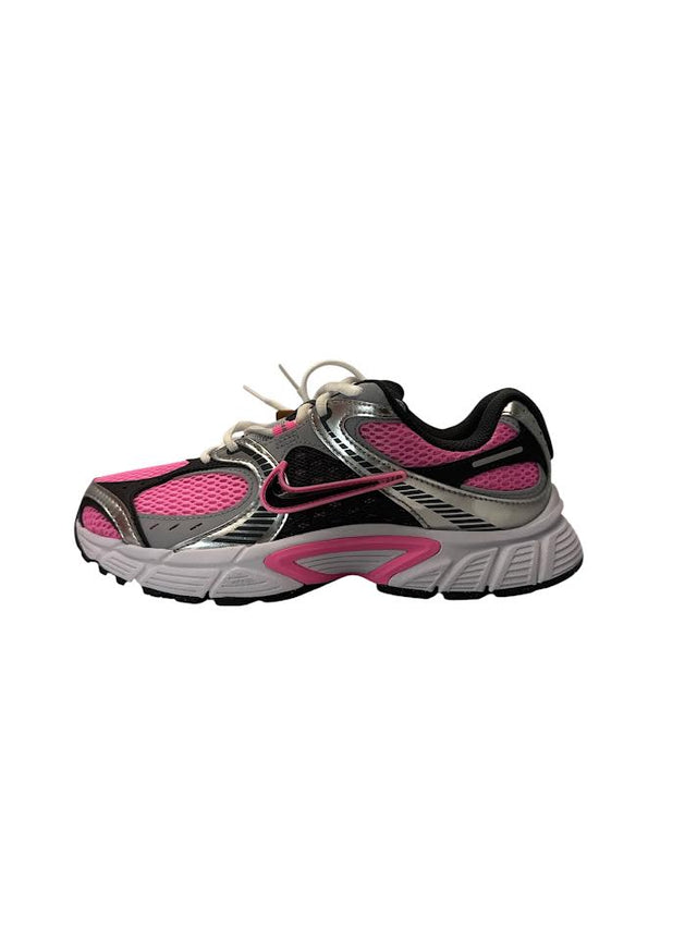 Gray and pink running shoe on a white background